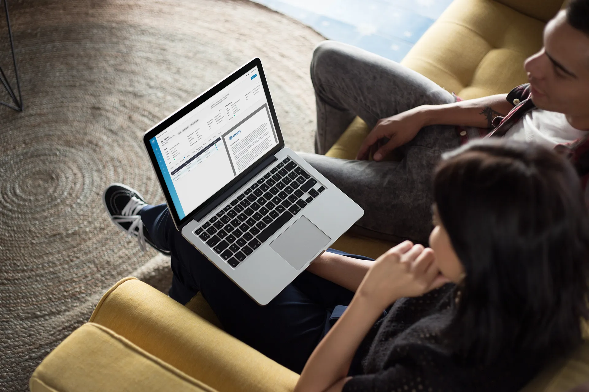 coworkers-working-on-a-macbook-mockup-while-talking-about-it-a20769.png